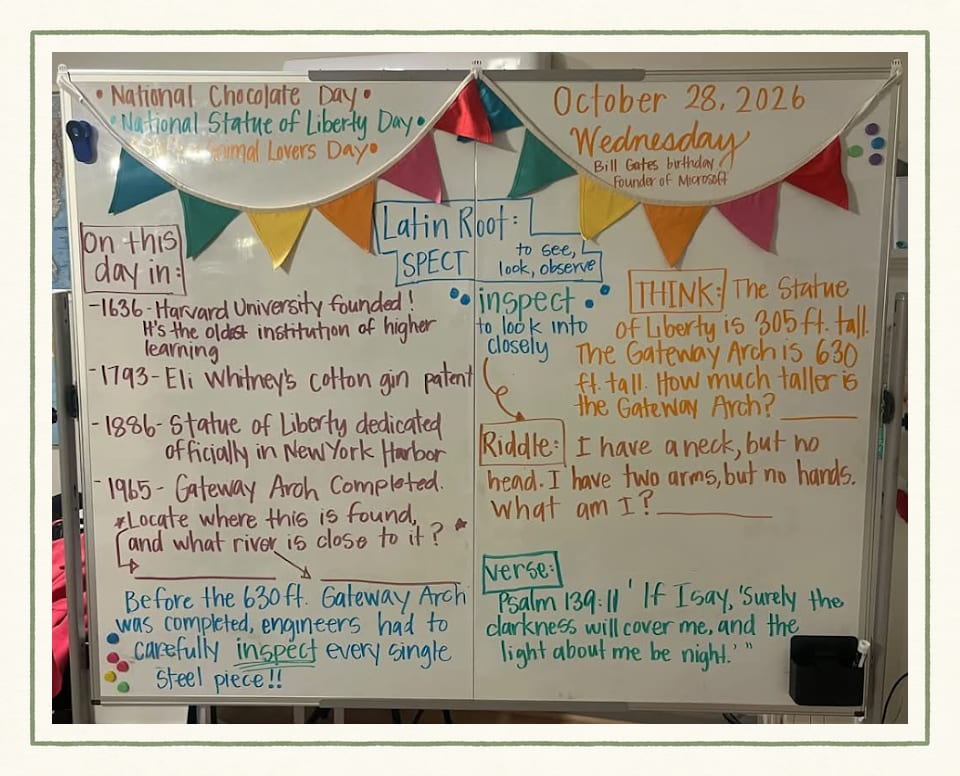 A whiteboard for Wednesday, October 28, 2026 under colorful bunting, with national days, an On this day list, the Latin root "spect," a Gateway Arch math question, a riddle and a Bible verse